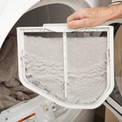 A dryer screen covered in lint.