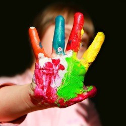 Close up of a child's hand painted.
