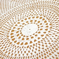 Closeup of crochet tablecloth.