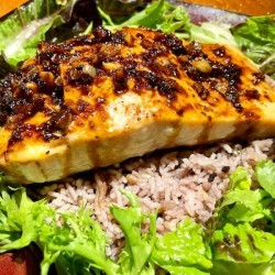 Sweet and Spicy Salmonon bed of rice with lettuce
