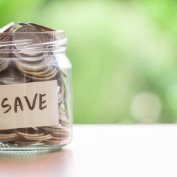Jar full of coins with the word 