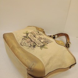 Restoring the Design on a Coach Purse - purse with worn design