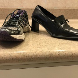 A sneaker next to a heeled dress shoe.