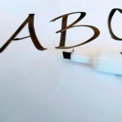 Removing Dry Erase Marker on Wood - A B C written on white background