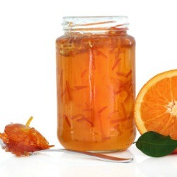 jar of marmalade and orange half