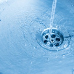 Water going down a sink drain.