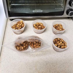 Individual portions of baked beans that have been frozen.