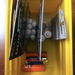 A collection of batteries in a container.