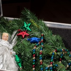 A box of Christmas decorating supplies.