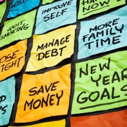 A wall of sticky notes with New Year resolutions.