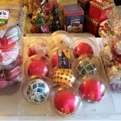 Christmas ornaments stored in plastic produce containers 