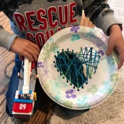 Heart Paper Plate Sewing Craft - child holding 