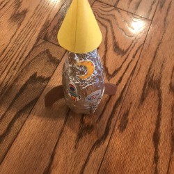 Making a Recycled Rocketship - finished rocketship with stickers added to foil covering