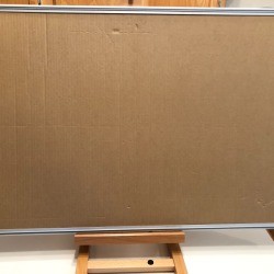 Spray for Felt on DIY Puzzle Board - puzzle board resting on an easel