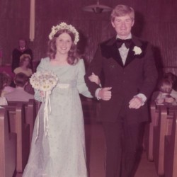 A couple walking down the aisle at their wedding.