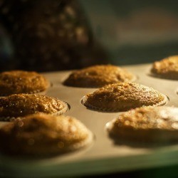 A tray of muffins baking in the oven.