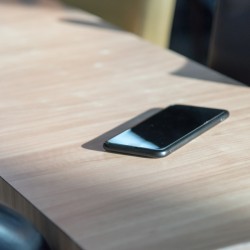 A cell phone sitting on a table or countertop.