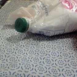 Using a recycled bottle and cap to seal powdered sugar.