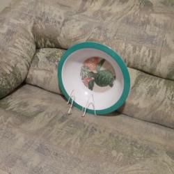 Making a Plate Stand - plate in homemade stand, sitting on couch