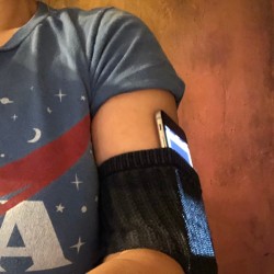 A sock being used as a DIY phone armband.