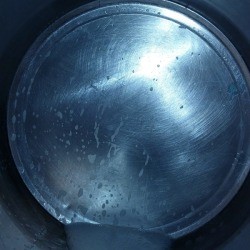 Metal Pizza Pan Stuck Inside a Stainless Steel Pot 
