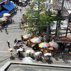Vendors selling flowers outside.