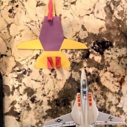 Making a Paper Jet - paper jet next to plastic toy one