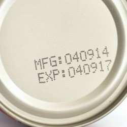An expiration date on a can of food.
