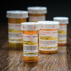 A collection of labeled prescription bottles