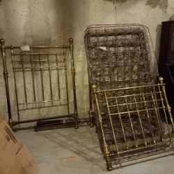 Value of Antique Brass Beds - beds leaning up against a wall