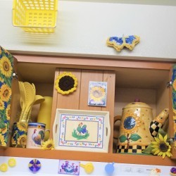 Above the Stove Sunflower Collection - finished decorated over the stove cabinet - full view with crochet sunflower and seed packet in the center