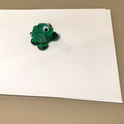 Egg Crate Turtle Paper Weight - frog on a stack of paper