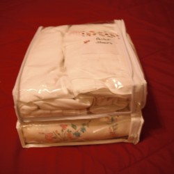 Linens stored in a clear zipper bag.