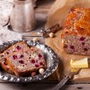 Cranberry nut bread loaf, with 2 slices cut.